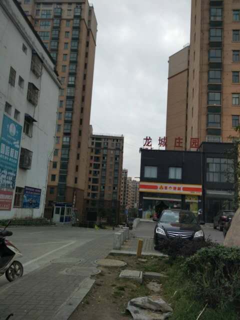龙成庄园3楼140平方毛坯房带车位96万出售